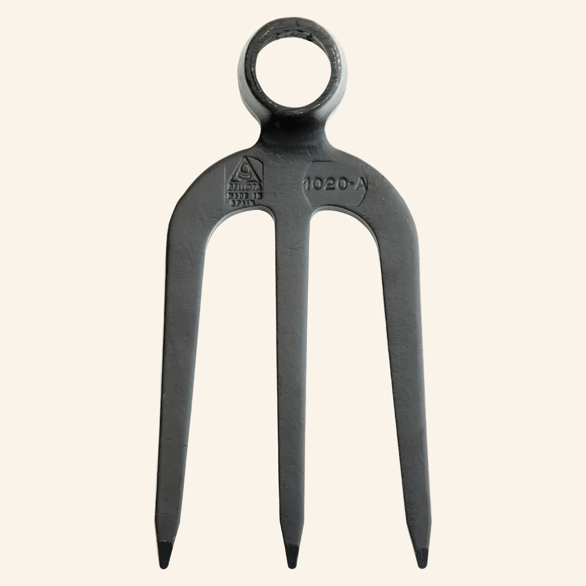 Black metal fork with a ring handle
