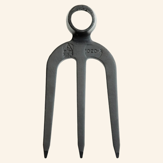 Black metal fork with a ring handle