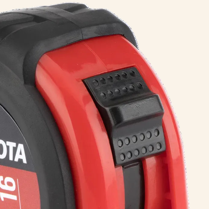 Close-up of a red and black tape measure with 'Bostitch' branding.
